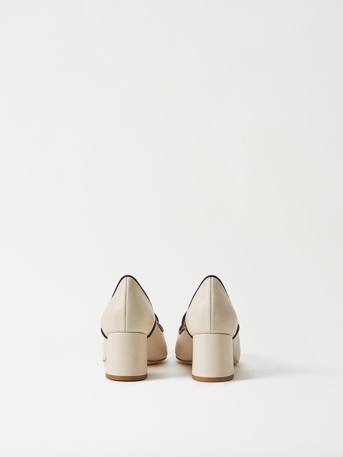 A Pair of Mavette Fiona Loafers Ivory Back View